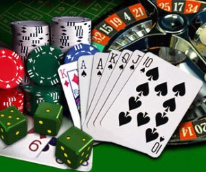 Cards, dice and a roulette wheel with chips